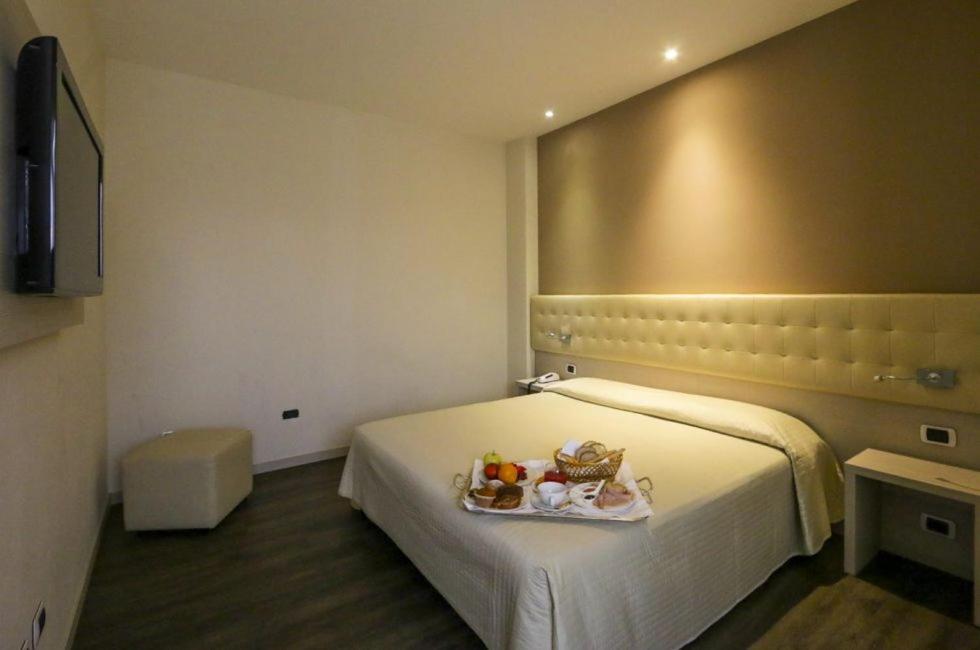 Łóżko lub łóżka w pokoju w obiekcie Hotel Norden Palace