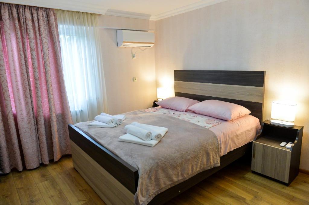 Postel nebo postele na pokoji v ubytování Cozy House