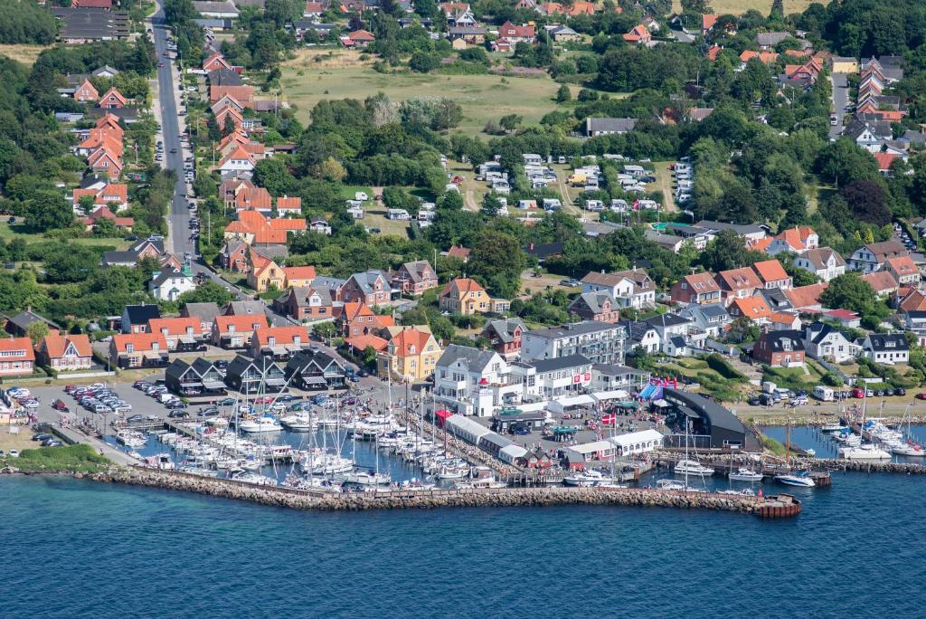 an aerial view of a harbor with boats in the water at Lohals camping in Tranekær