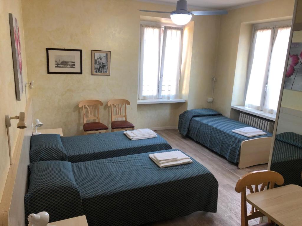 Postel nebo postele na pokoji v ubytování Antico Albergo