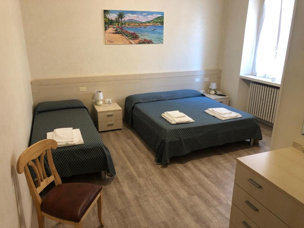 Postel nebo postele na pokoji v ubytování Antico Albergo