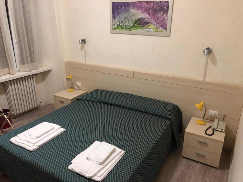 Postel nebo postele na pokoji v ubytování Antico Albergo
