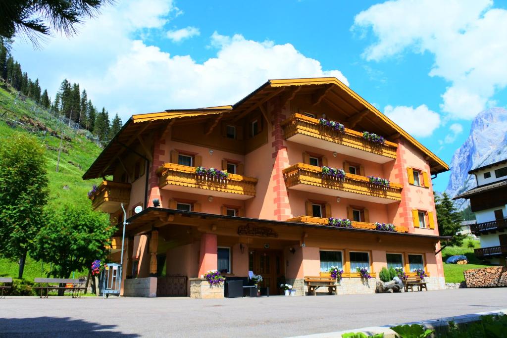 a building with balconies on the side of it at Villa Clara in Canazei