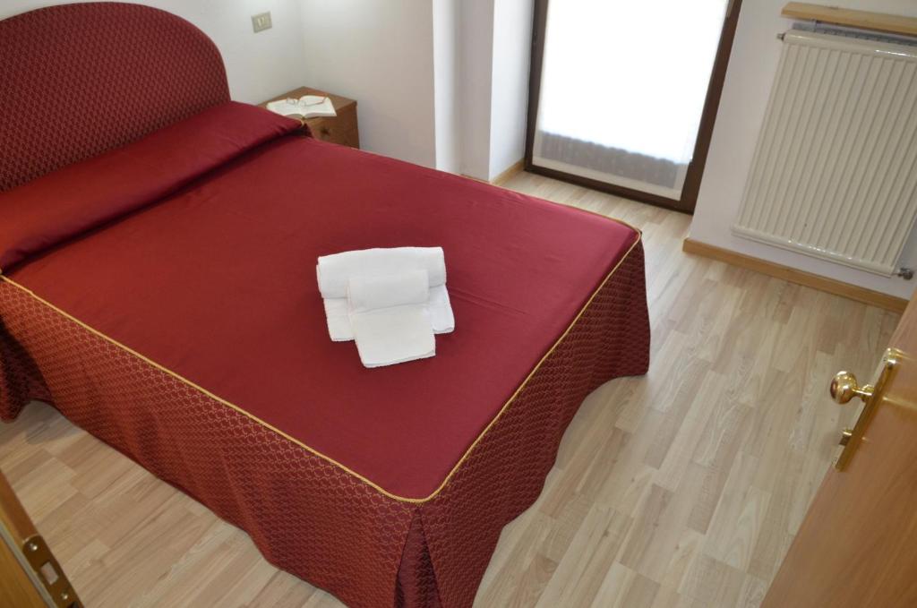 Postel nebo postele na pokoji v ubytování Hotel Corona