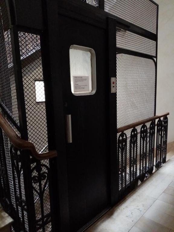 a black door with a sign on it at Guesthouse City Center in Bari