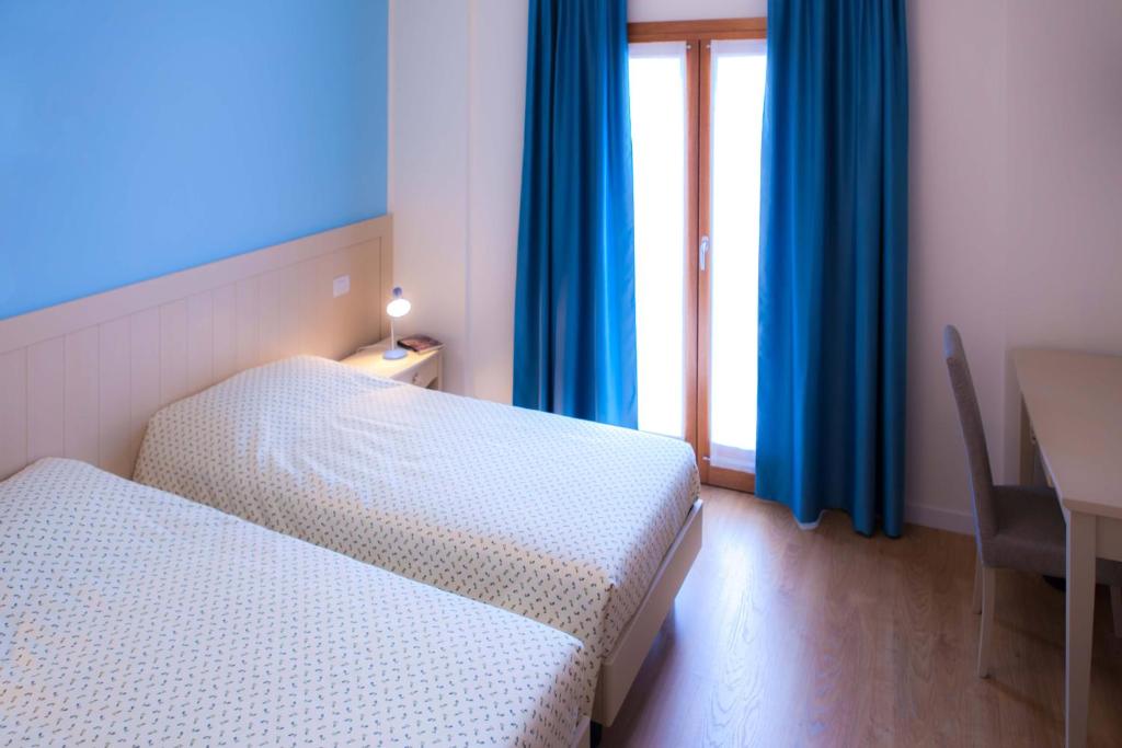 A bed or beds in a room at Agriturismo la Chiocciola