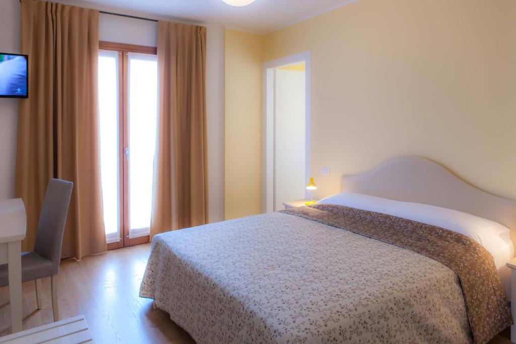 A bed or beds in a room at Agriturismo la Chiocciola