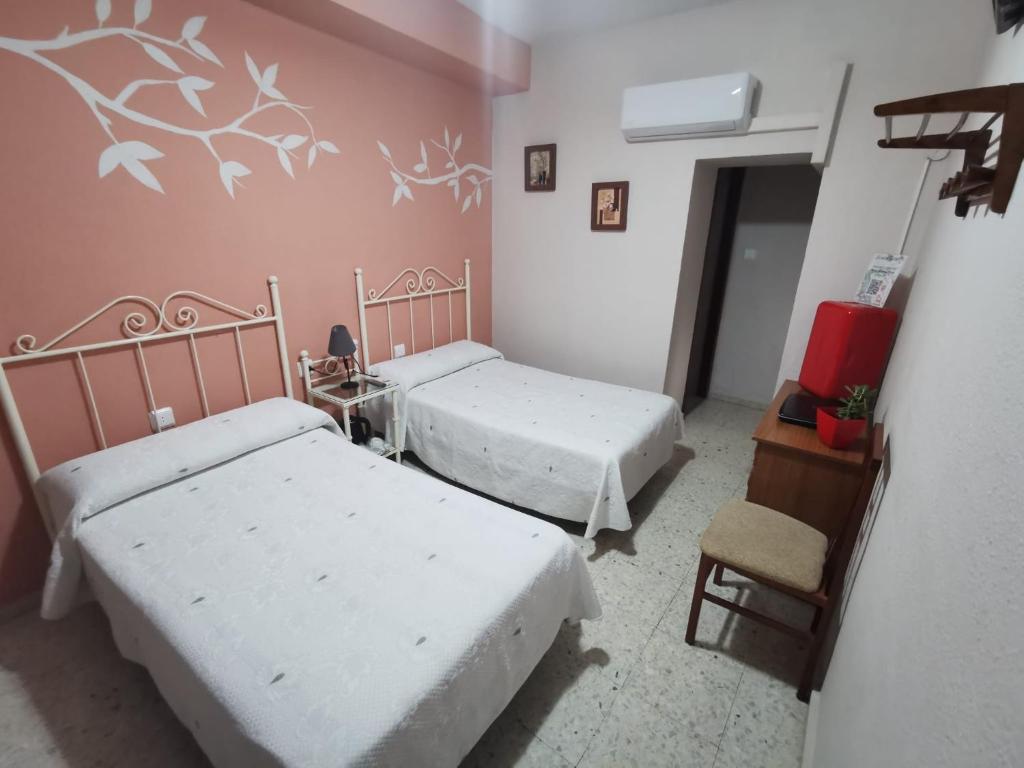 Cama o camas de una habitación en Hostal Senero