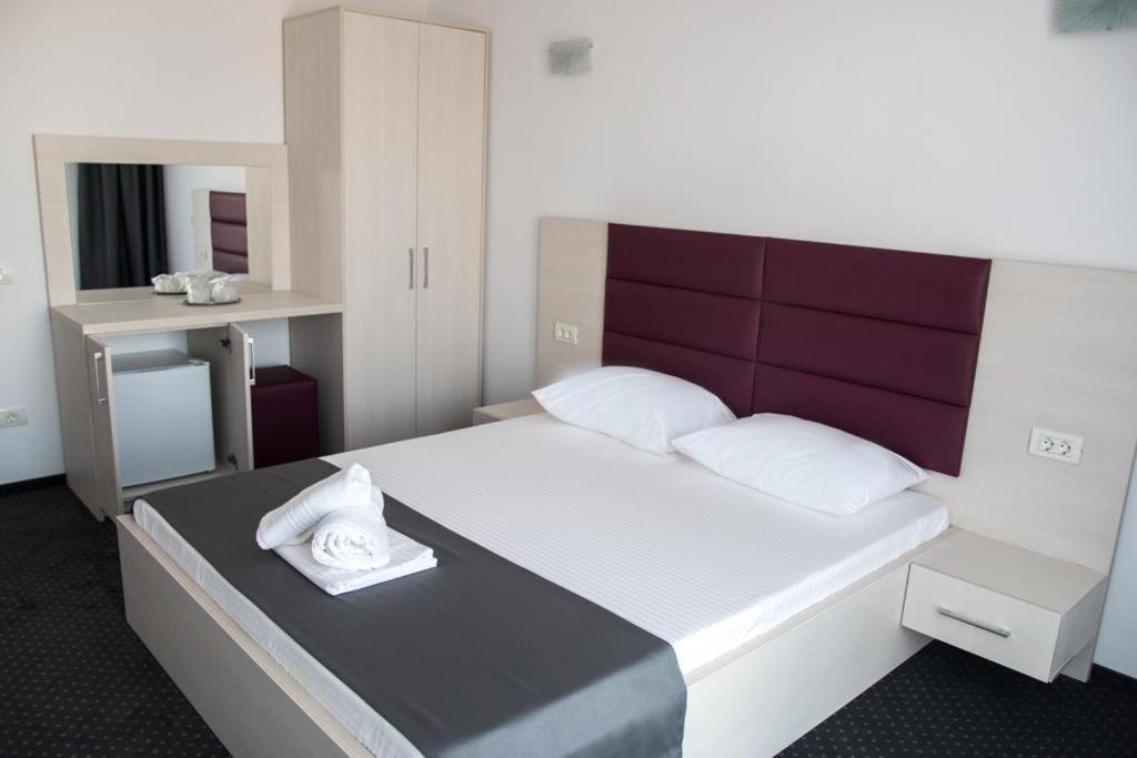 Postel nebo postele na pokoji v ubytování Hotel Premium