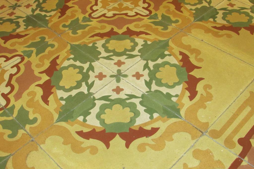 a tile floor with a flower pattern on it at Guesthouse City Center in Bari