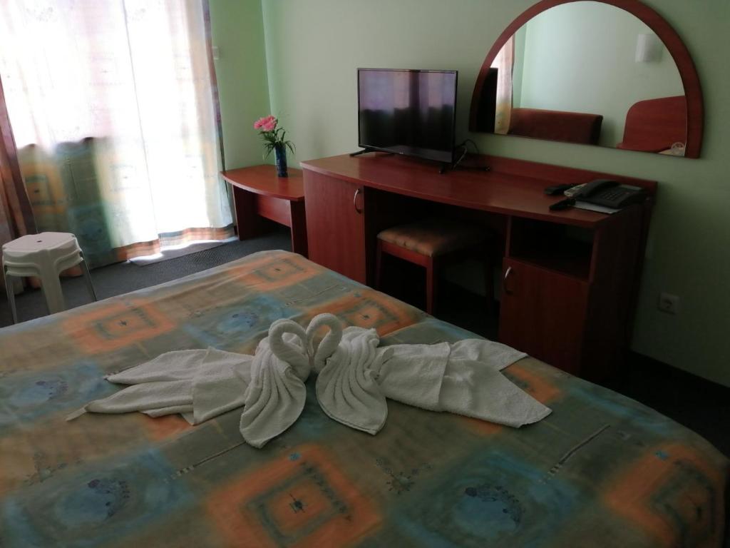 Postel nebo postele na pokoji v ubytování Hotel Sunset Beach