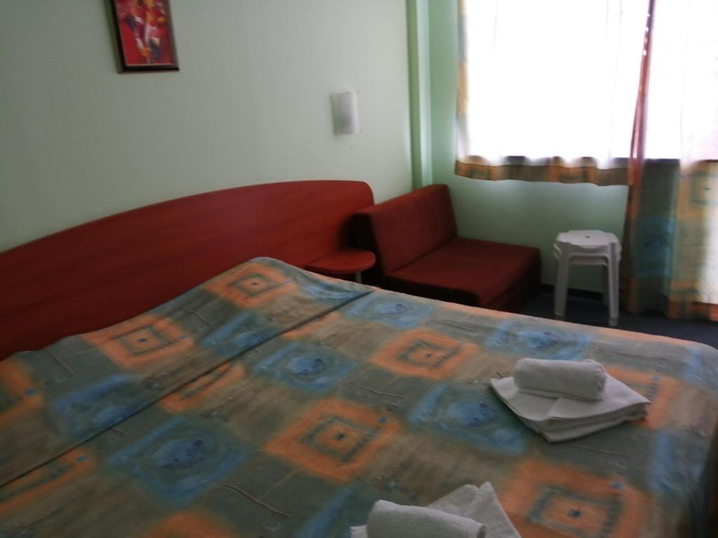 Postel nebo postele na pokoji v ubytování Hotel Sunset Beach