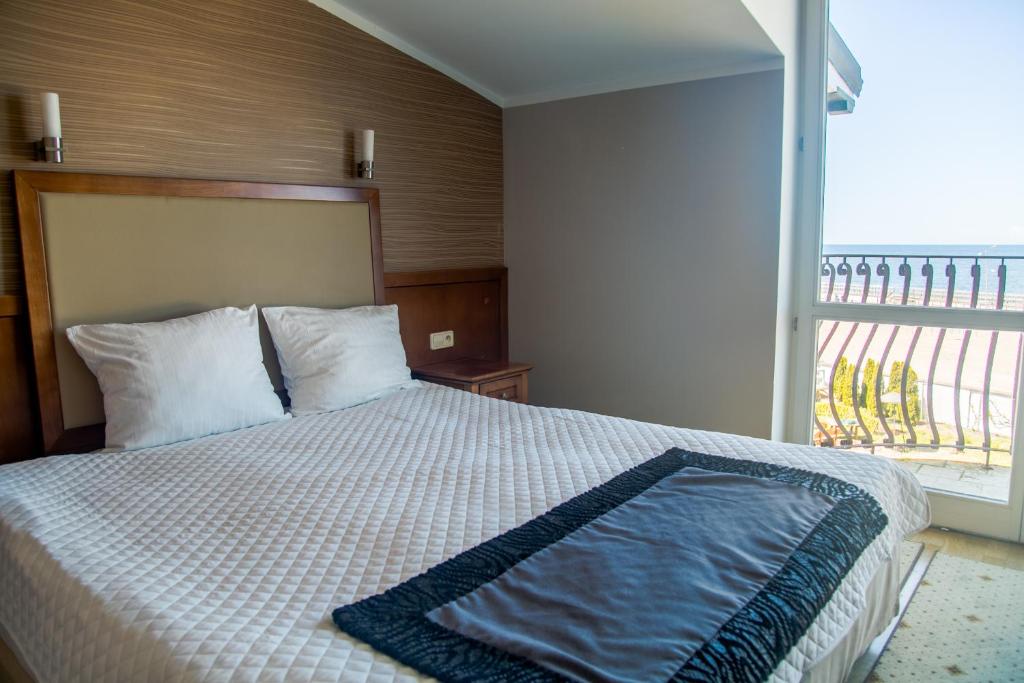 Postel nebo postele na pokoji v ubytování Hotel Apollo