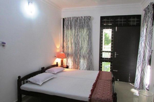 Tempat tidur dalam kamar di Immanuel Home Stay