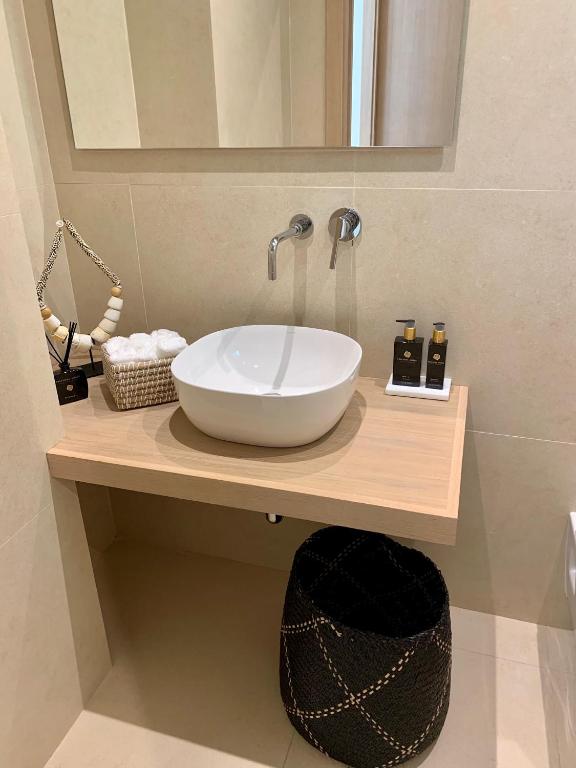a bathroom with a bowl sink on a counter at Casa Bodhi Boutique Hotel & Spa in Marbella