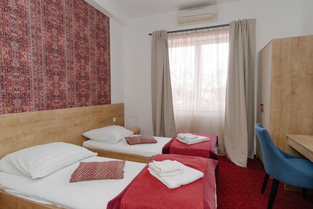 Postel nebo postele na pokoji v ubytování Oázis Panzió