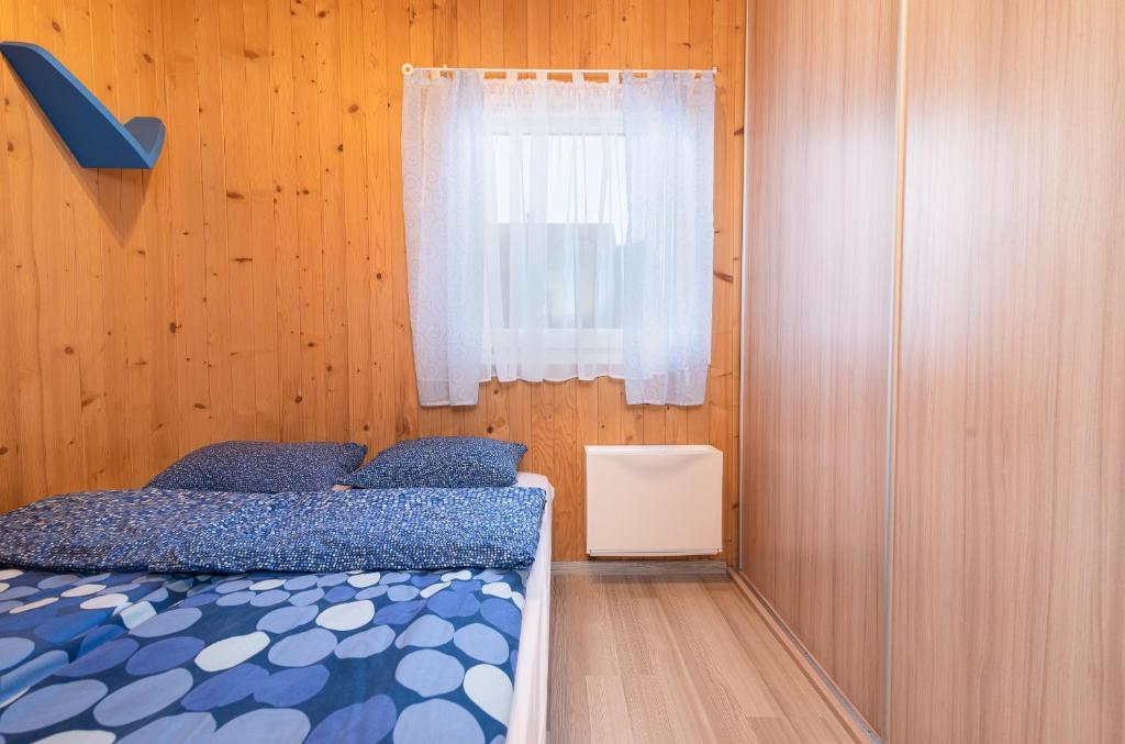 Postel nebo postele na pokoji v ubytování Domki SOLE