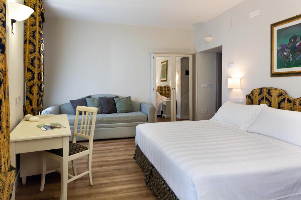 Cama ou camas em um quarto em Hotel Fontebella