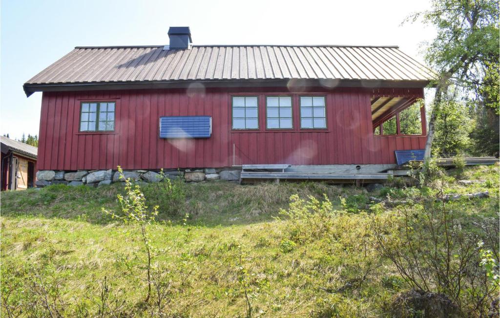a red house on top of a hill at 3 Bedroom Nice Home In Sr-fron in Sør-Fron