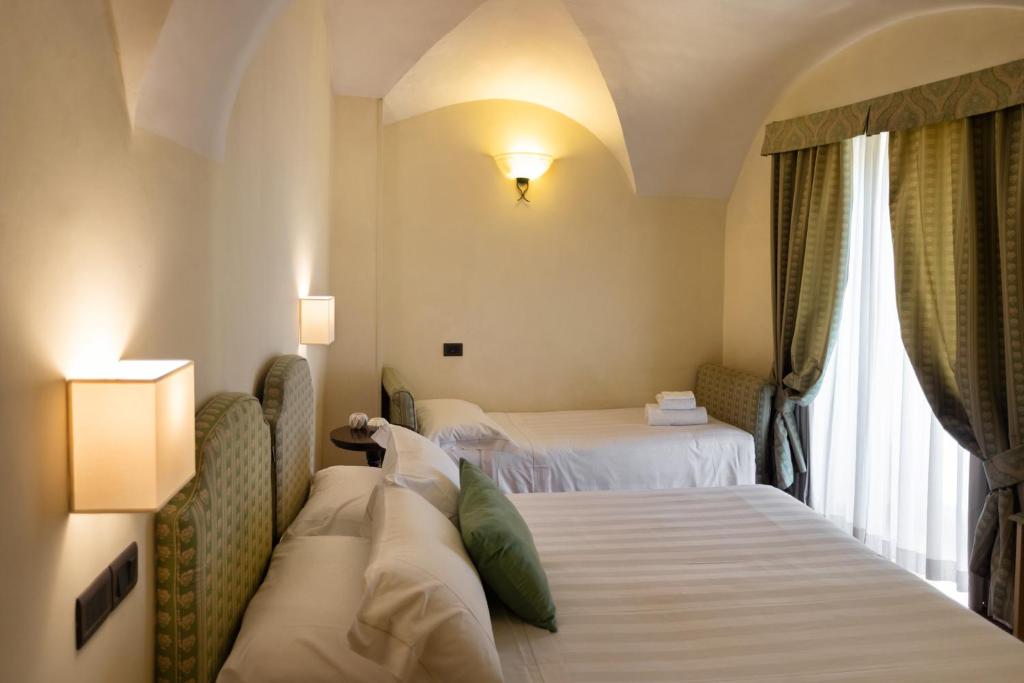 Cama ou camas em um quarto em Hotel Fontebella