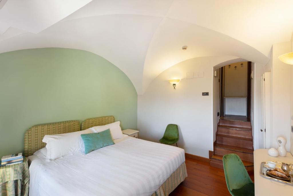 Cama ou camas em um quarto em Hotel Fontebella