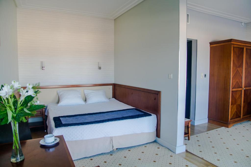 Postel nebo postele na pokoji v ubytování Hotel Apollo