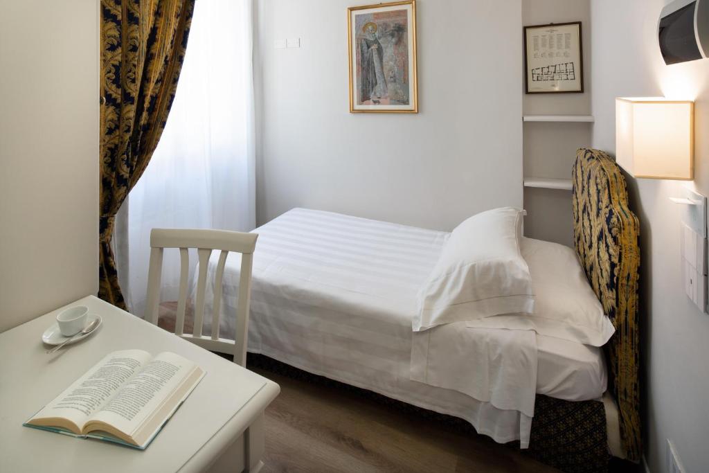 Cama ou camas em um quarto em Hotel Fontebella