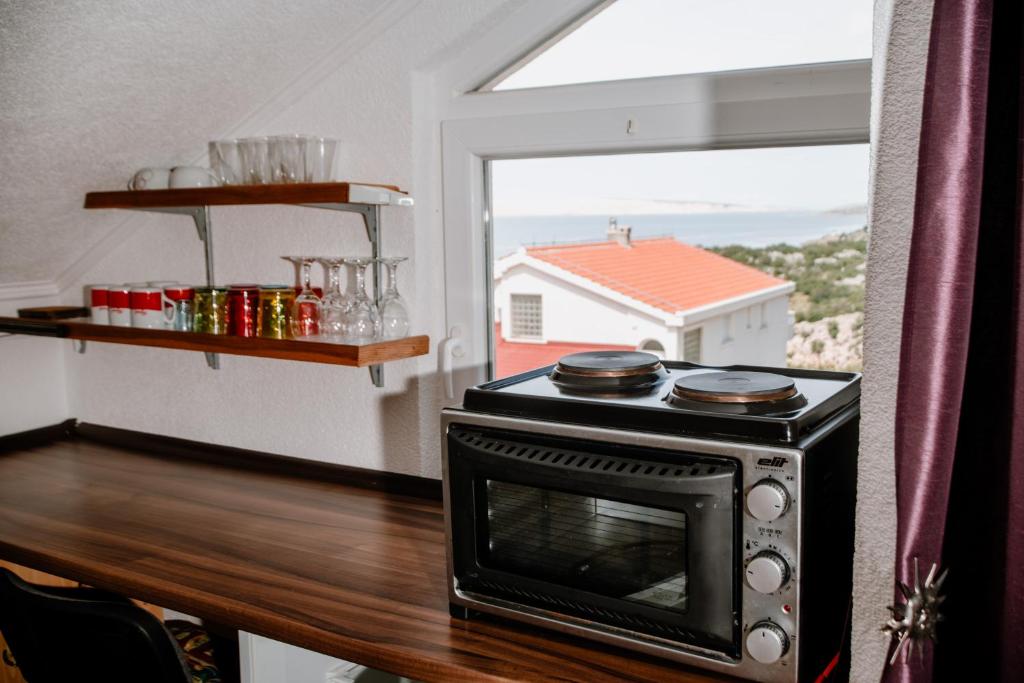 Kuchyň nebo kuchyňský kout v ubytování Apartmens Leona