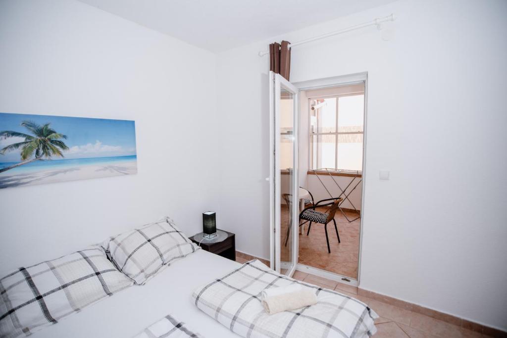 Postel nebo postele na pokoji v ubytování Apartmens Leona