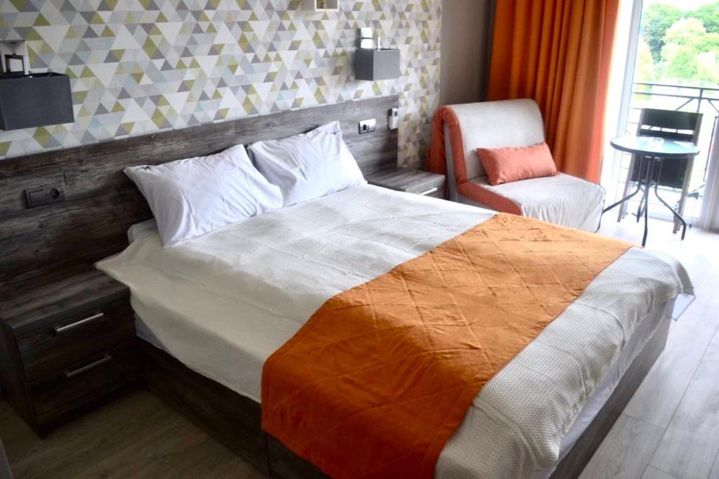 Postel nebo postele na pokoji v ubytování Village apartments Polyana