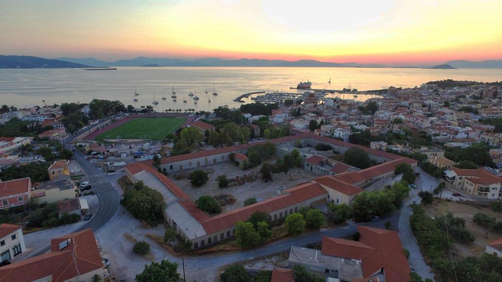 an aerial view of a town next to the water at Pistakion Houses in Aegina Town