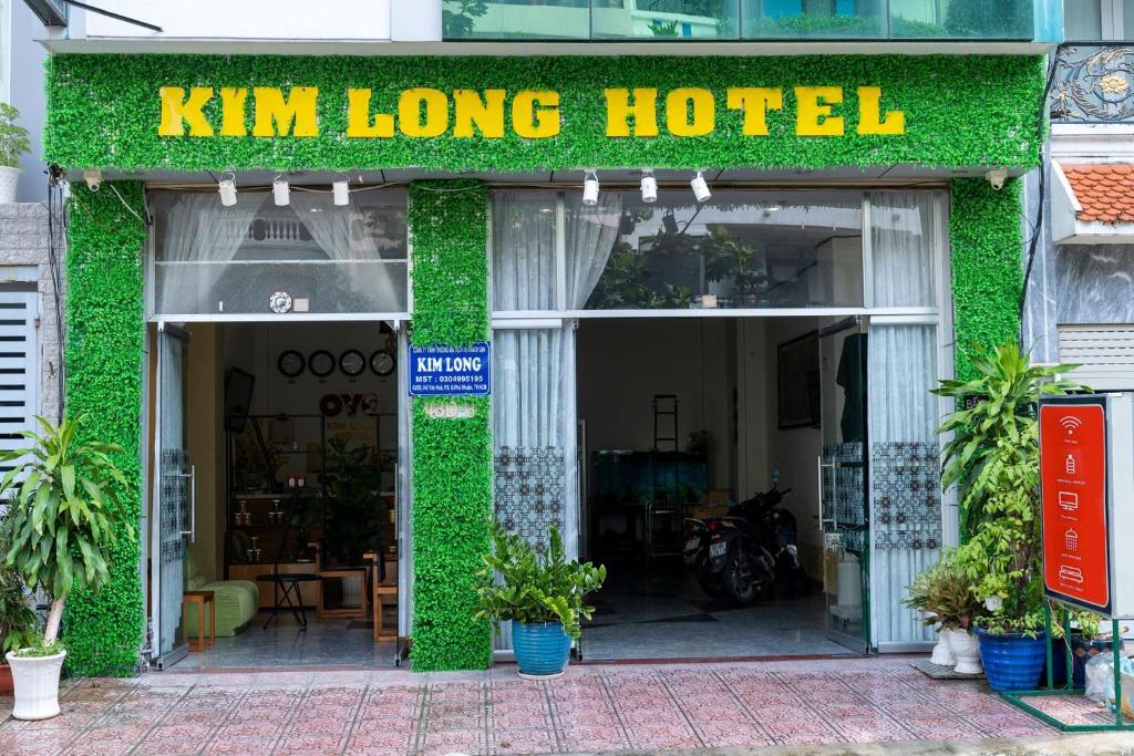 a kim long hotel with green ivy on the facade at Aqua Kim Long Hotel in Ho Chi Minh City