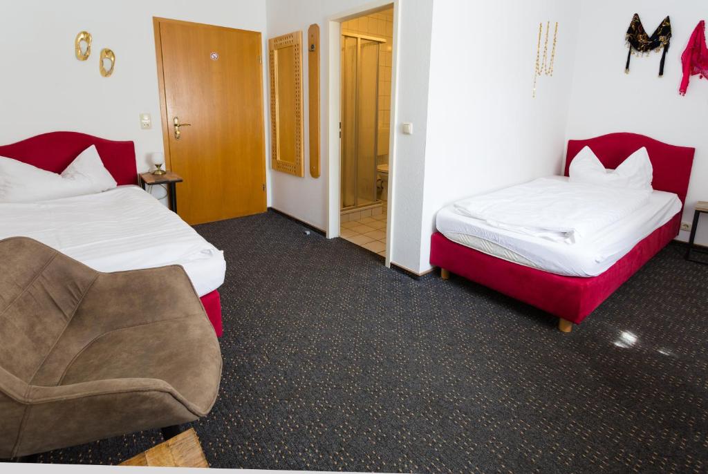 Postel nebo postele na pokoji v ubytování Hotel & Ferienwohnungen Bohlenblick