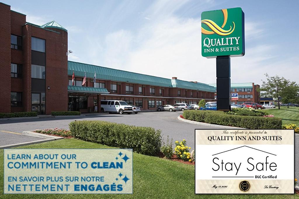a sign in front of a building at Quality Inn & Suites PE Trudeau Airport in Dorval