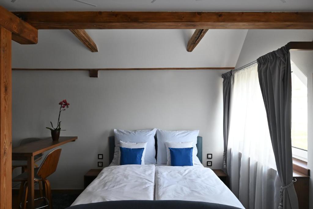 Postel nebo postele na pokoji v ubytování Apartmány Spessart