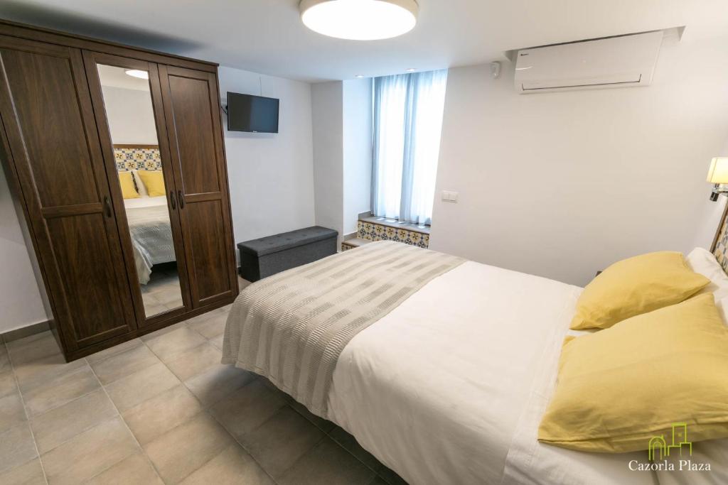 Postel nebo postele na pokoji v ubytování Cazorla Plaza