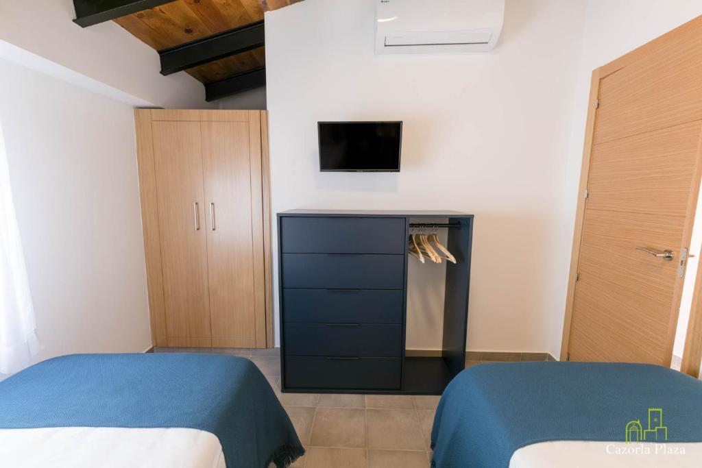 Postel nebo postele na pokoji v ubytování Cazorla Plaza