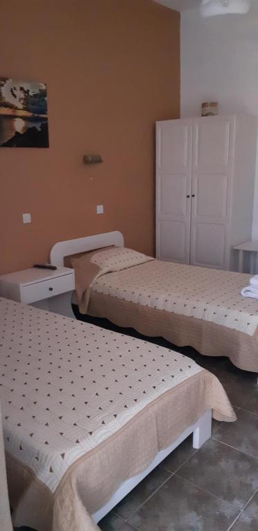 Postel nebo postele na pokoji v ubytování Antonia Rooms