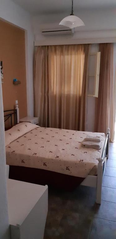 Postel nebo postele na pokoji v ubytování Antonia Rooms