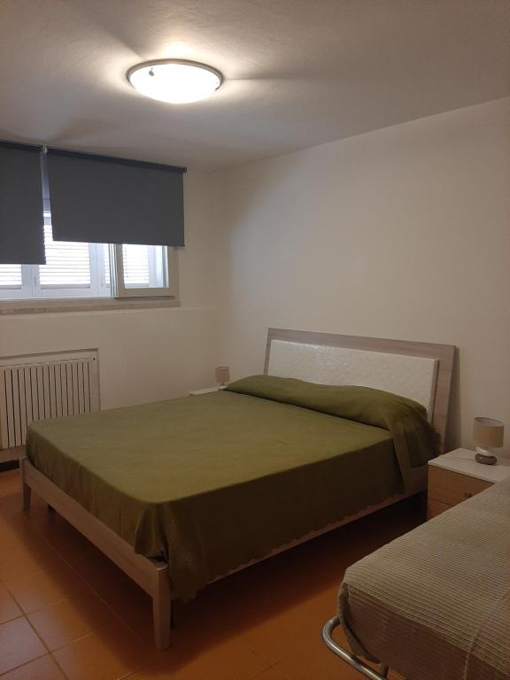 Postel nebo postele na pokoji v ubytování Lomarchi Holiday Home