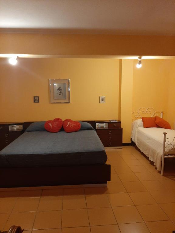 Postel nebo postele na pokoji v ubytování Lomarchi Holiday Home
