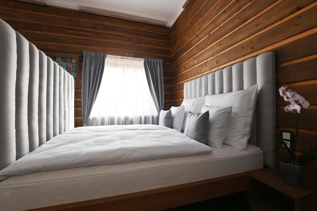 Postel nebo postele na pokoji v ubytování Apartmány Spessart