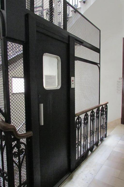 a black door with a window on it at Guesthouse City Center in Bari
