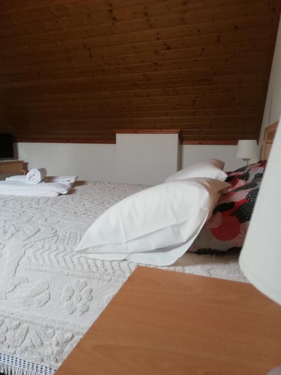 Postel nebo postele na pokoji v ubytování casa cardeal saraiva