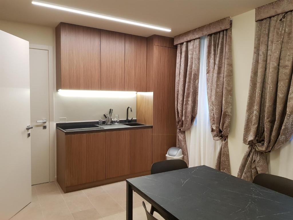a kitchen with a sink and a table at Hotel Aquarius Venice - Ascend Collection in Venice