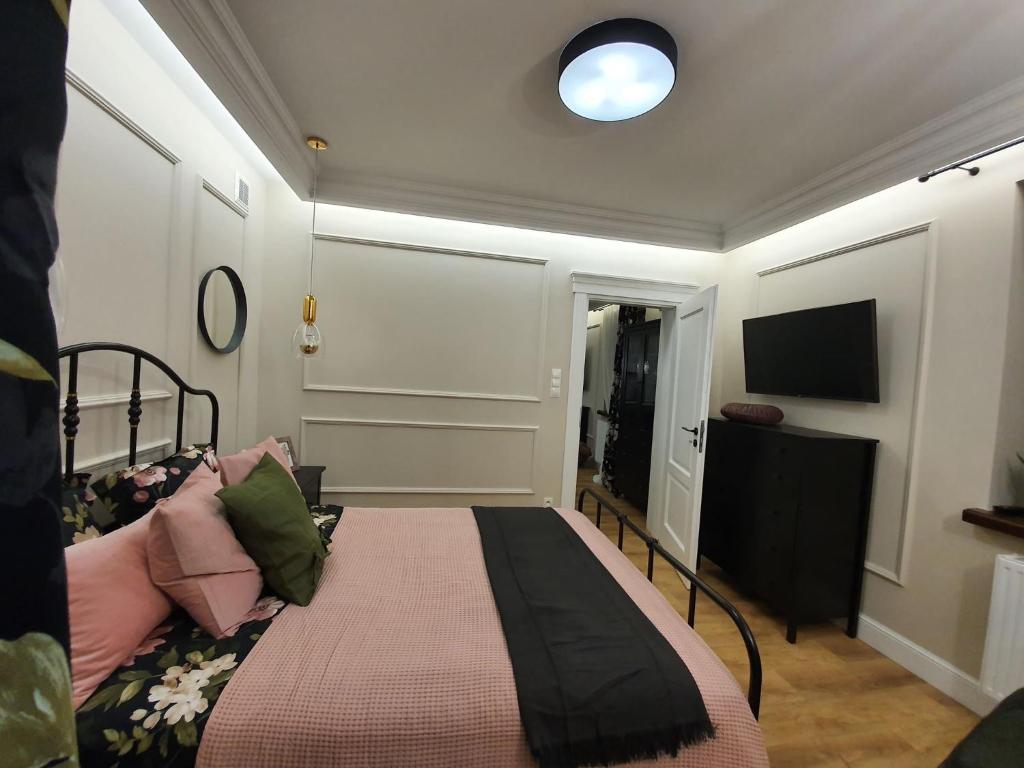Postel nebo postele na pokoji v ubytování Apartament w sercu Zamojskiej Starówki
