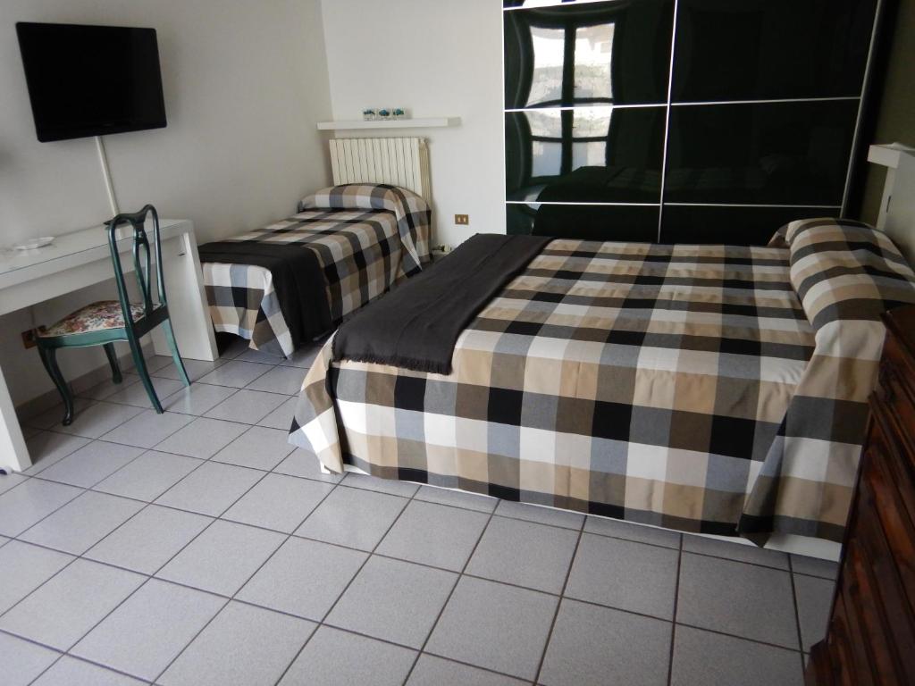 Postel nebo postele na pokoji v ubytování 3per3