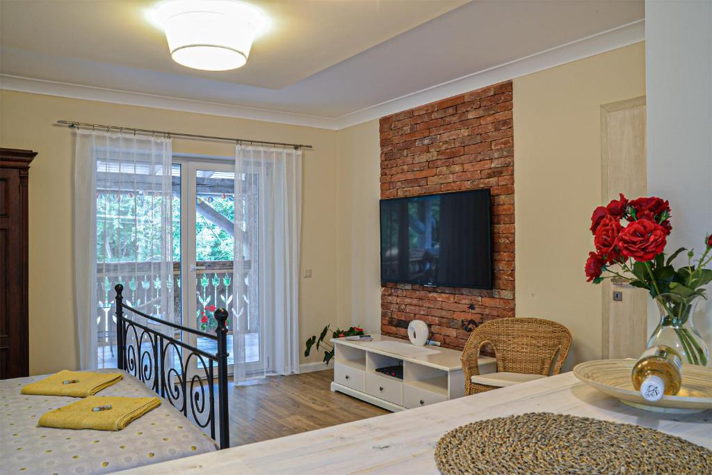 TV a/nebo společenská místnost v ubytování Terrace Apartments