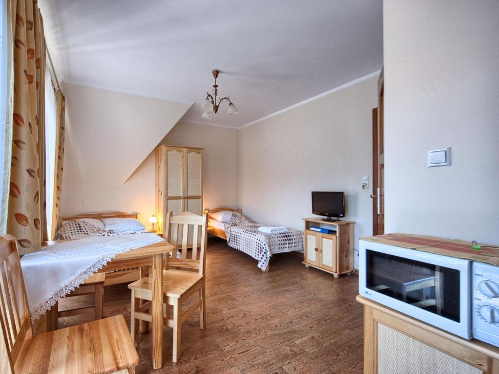 Posteľ alebo postele v izbe v ubytovaní VisitZakopane - City Apartments