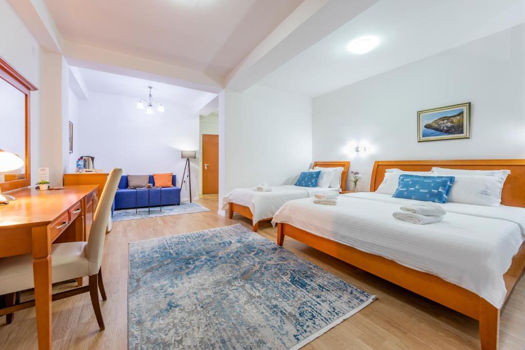 Postel nebo postele na pokoji v ubytování Vila Niko